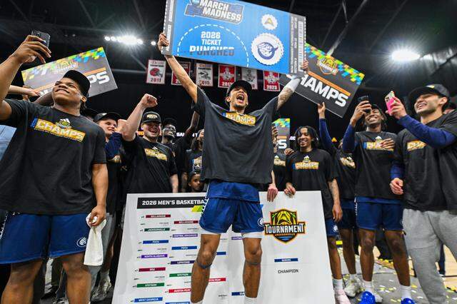 Queens celebrates punching its ticket to the NCAA men’s basketball tournament and March Madness on Sunday.